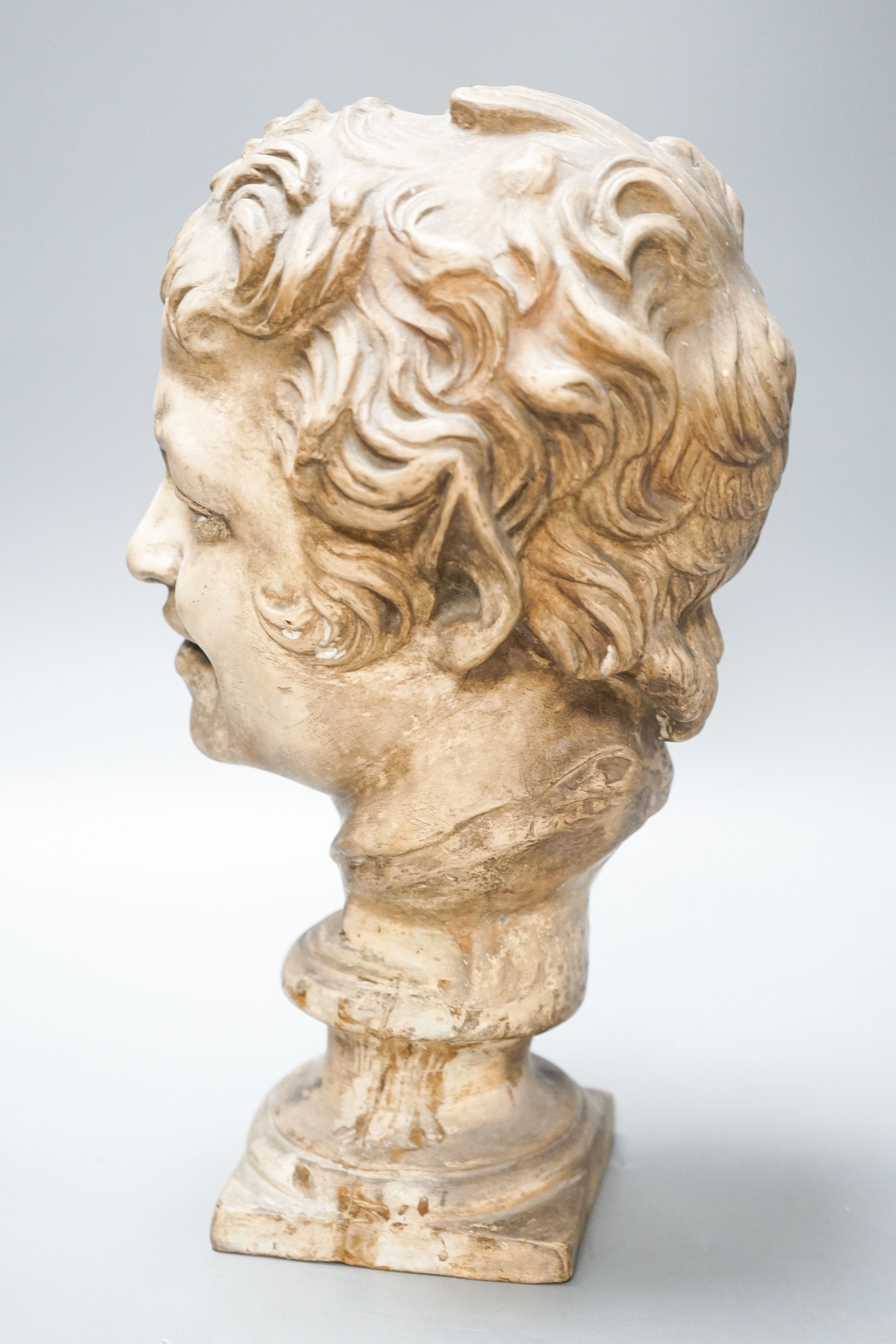 An earthenware bust of a faun, 32cm